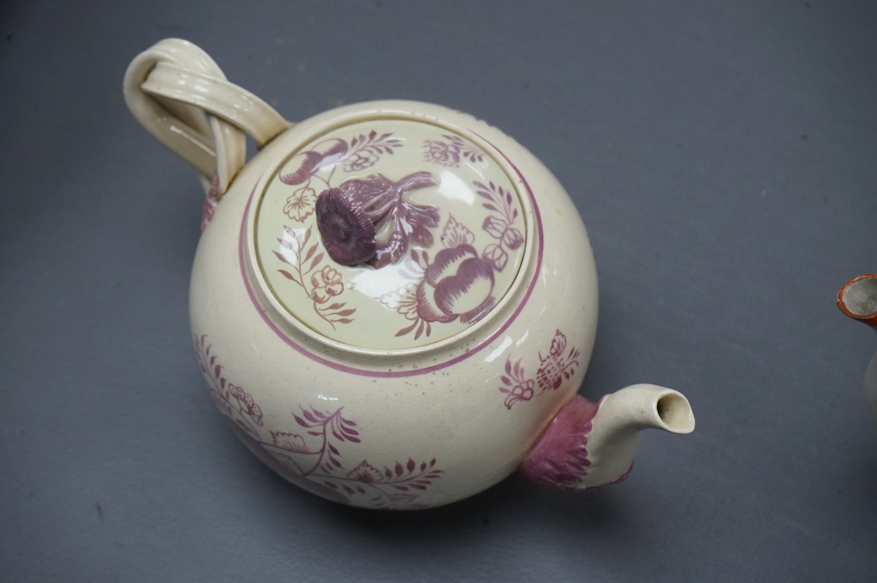 Leeds pottery, a creamware teapot, c.1785 and a pearlware teapot, c.1795, both stamped, tallest 13cm high